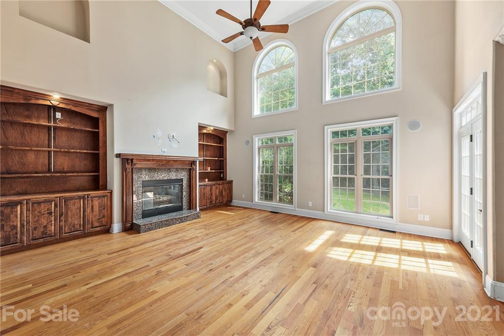 3268 Millstone Creek Road Lancaster, SC 29720 - Photo 8 of 35 an empty room with windows fireplace and outdoor view