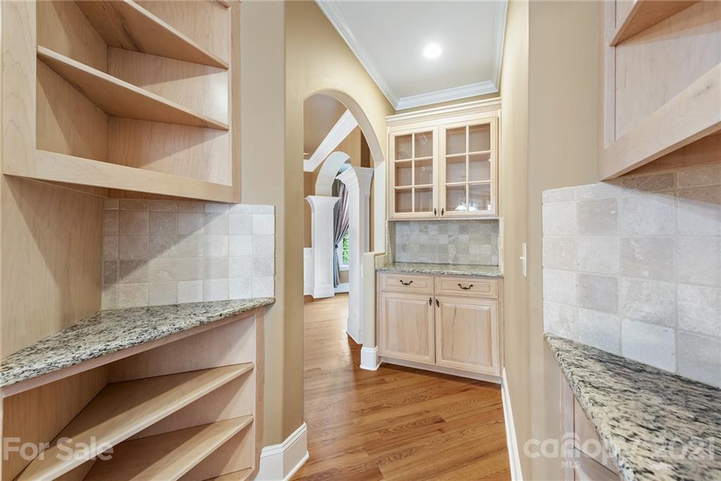 3268 Millstone Creek Road Lancaster, SC 29720 - Photo 10 of 35 a hallway with granite countertop stainless steel appliances and cabinets