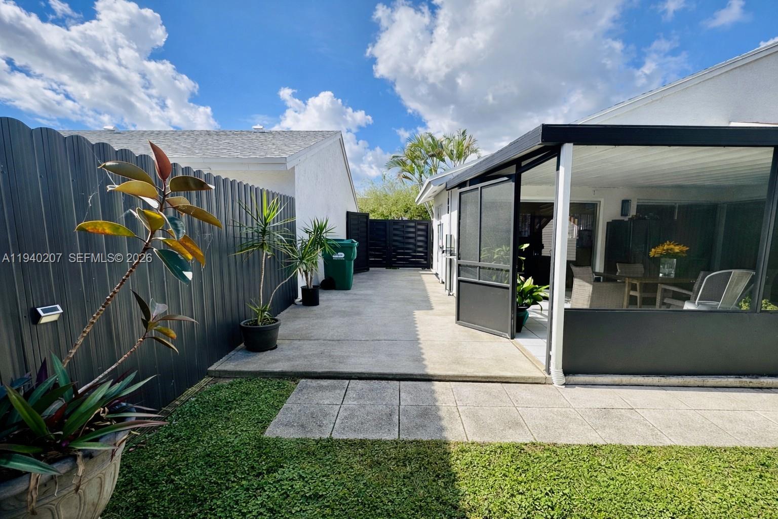 20125 Southwest 124th Avenue Miami, FL 33177 - Photo 18 of 21 a view of a house with a patio