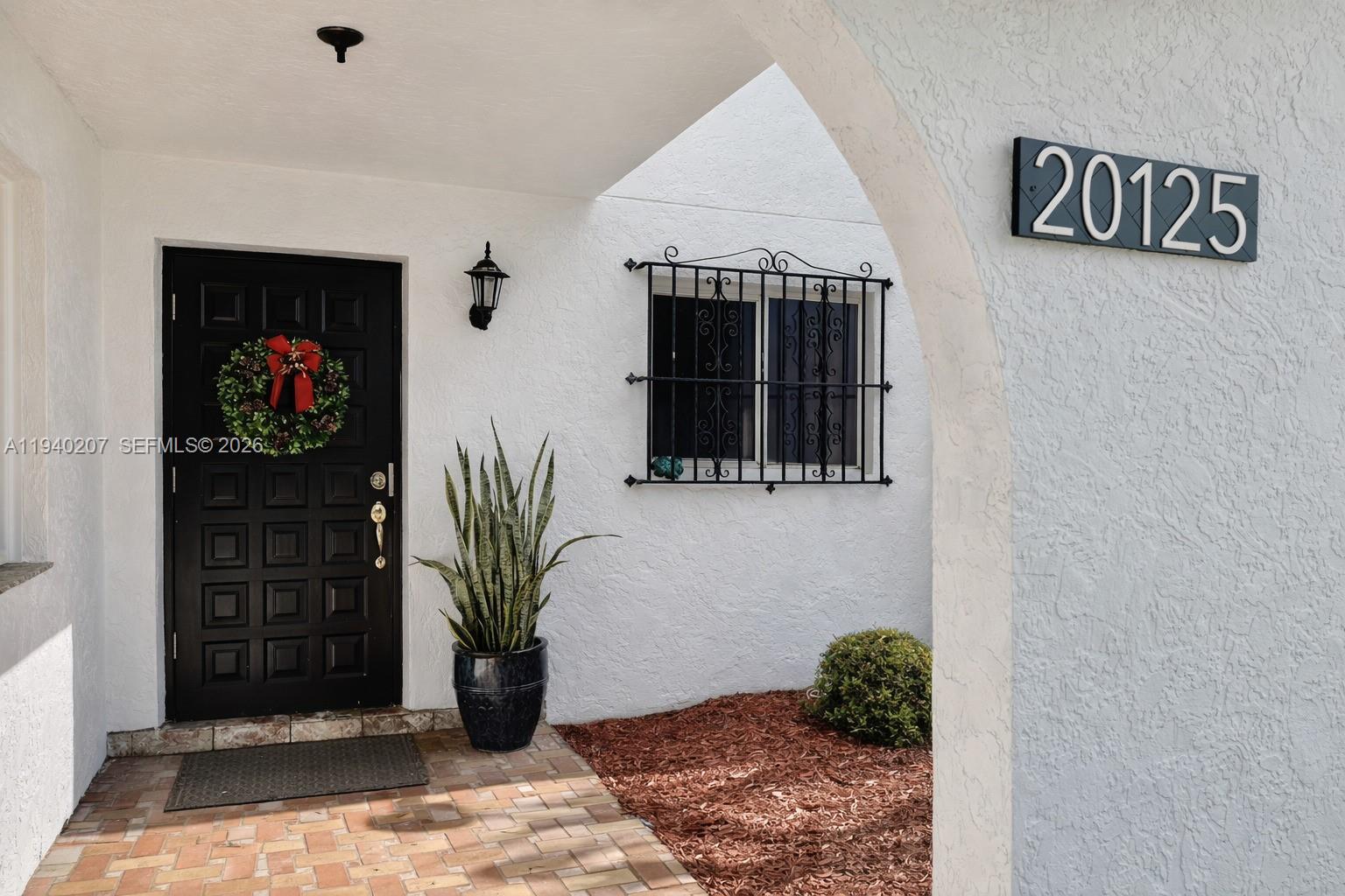 20125 Southwest 124th Avenue Miami, FL 33177 - Photo 2 of 21 a view of entryway with livingroom