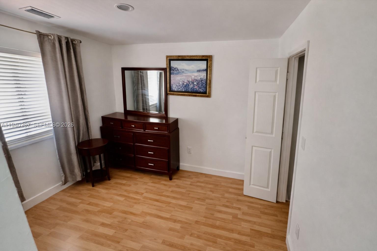 20125 Southwest 124th Avenue Miami, FL 33177 - Photo 6 of 21 a room with a dresser and a mirror