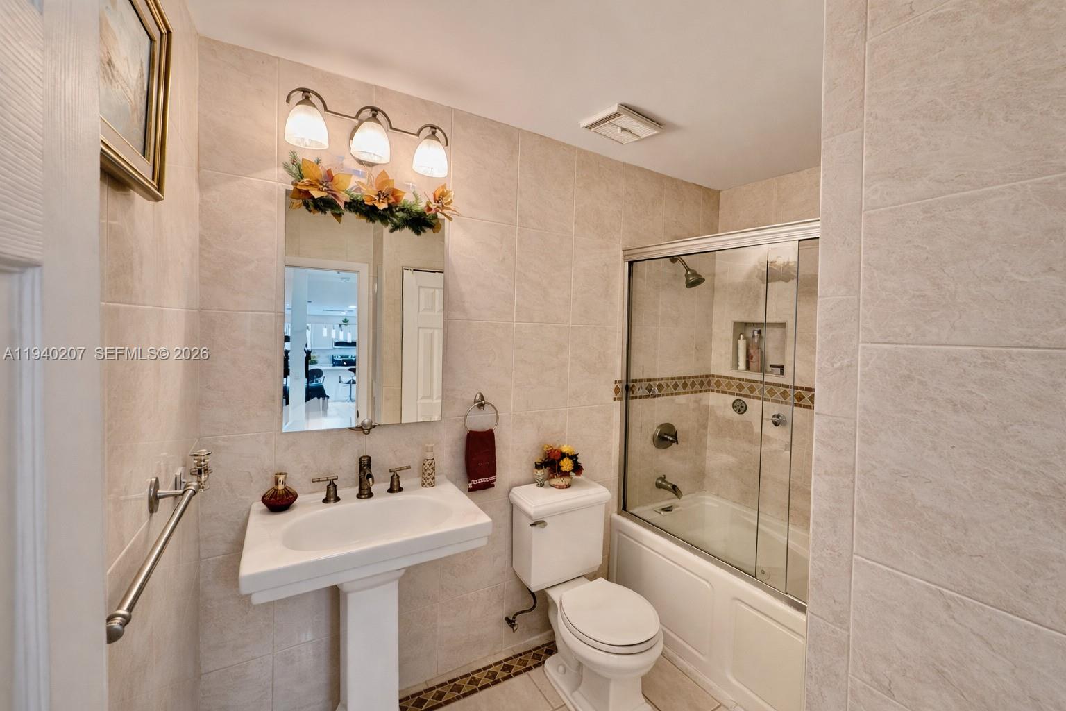 20125 Southwest 124th Avenue Miami, FL 33177 - Photo 8 of 21 a bathroom with a sink toilet and shower