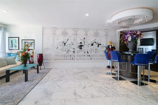 a living room with furniture potted plant and a window