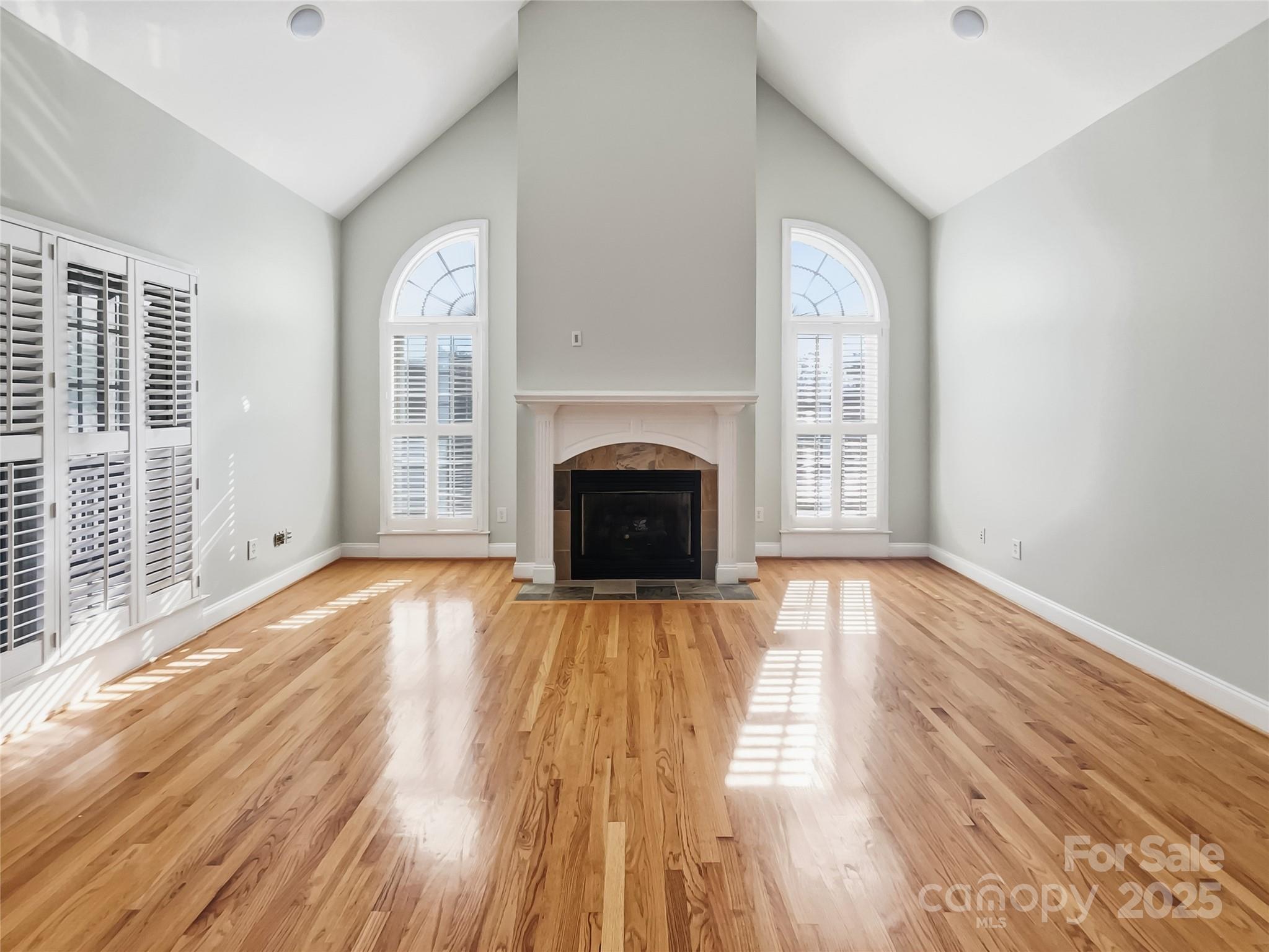 924 Ferguson Ridge Road Gastonia, NC 28052 - Photo 3 of 23 a view of a livingroom with wooden floor and a fireplace