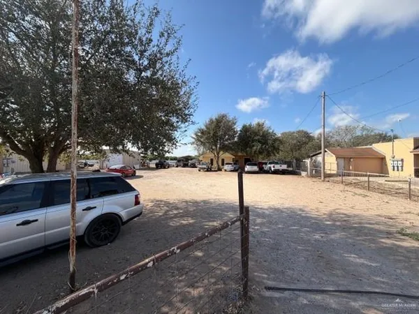 a view of street with parked cars