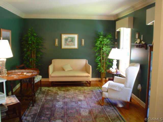15004 Walnut Bend Road Midlothian, VA 23112 - Photo 2 of 10 a living room with furniture and a potted plant