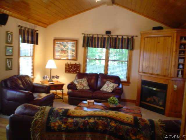 15004 Walnut Bend Road Midlothian, VA 23112 - Photo 5 of 10 a living room with furniture fireplace and window