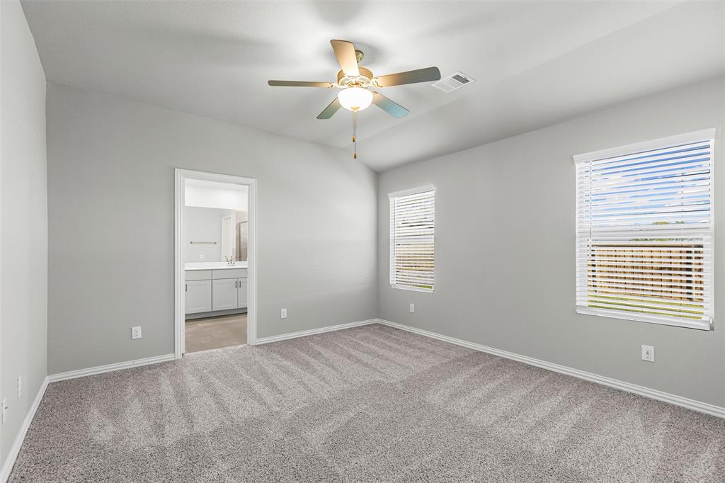 10508 Brookshire Road Fort Worth, TX 76126 - Photo 13 of 31 Large Primary Bedroom with tons of natural light and ensuite bath with a large walk-in closet!
