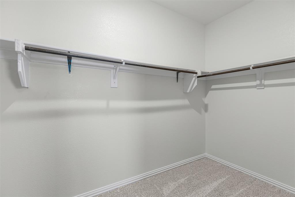 10508 Brookshire Road Fort Worth, TX 76126 - Photo 17 of 31 Large Primary Bedroom with tons of natural light and ensuite bath with a large walk-in closet!