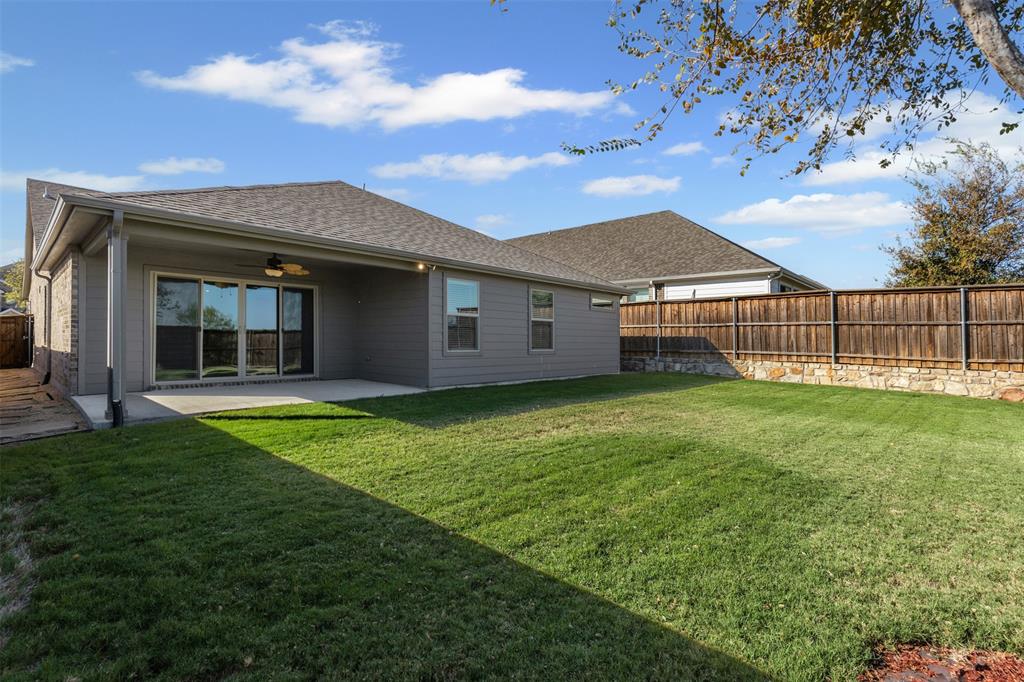 10508 Brookshire Road Fort Worth, TX 76126 - Photo 24 of 31 Rear view of property with roof with shingles, a fenced backyard, a patio area, and ceiling fan