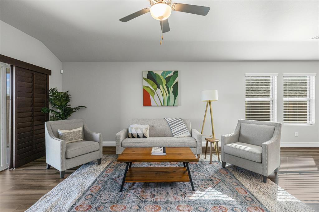 10508 Brookshire Road Fort Worth, TX 76126 - Photo 7 of 31 Living area featuring plenty of natural light, dark wood-type flooring, and vaulted ceiling