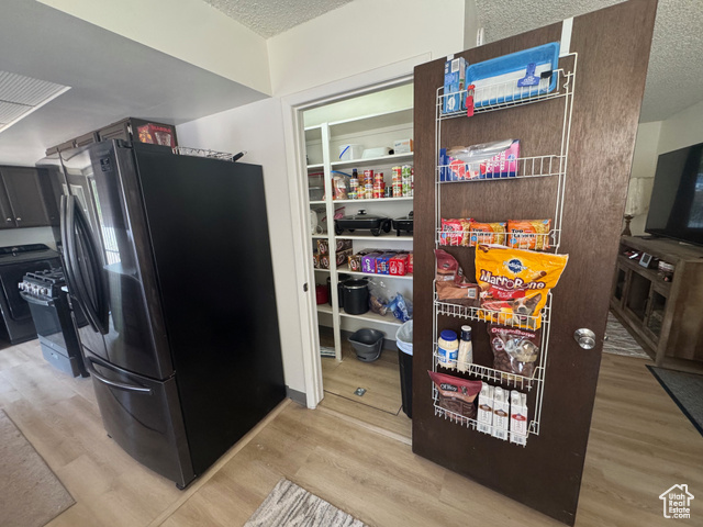 527 Palisade Drive Moab, UT 84532 - Photo 7 of 51 Large walk in pantry with new flooring and paint.