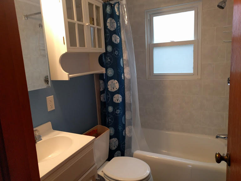 49 Lower County Road, Unit 15 Dennis Port, MA 02639 - Photo 4 of 7 a bathroom with a sink toilet and shower