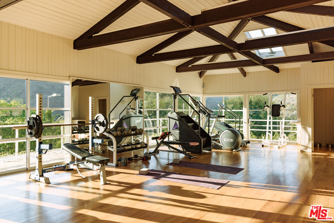 3100 Mandeville Canyon Road Los Angeles, CA 90049 - Photo 16 of 23 a view of a room with gym equipment