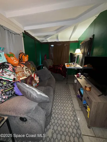 a room with lots of different colored cloths and lots of stuff