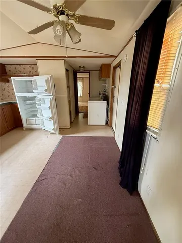 a view of a hallway with a couch