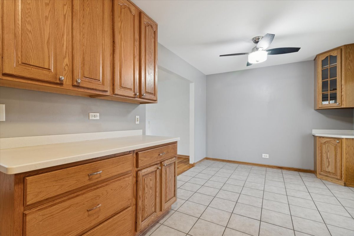 26-w028 Prairie Avenue Wheaton, IL 60187 - Photo 12 of 28 a view of an empty room with window and cabinet