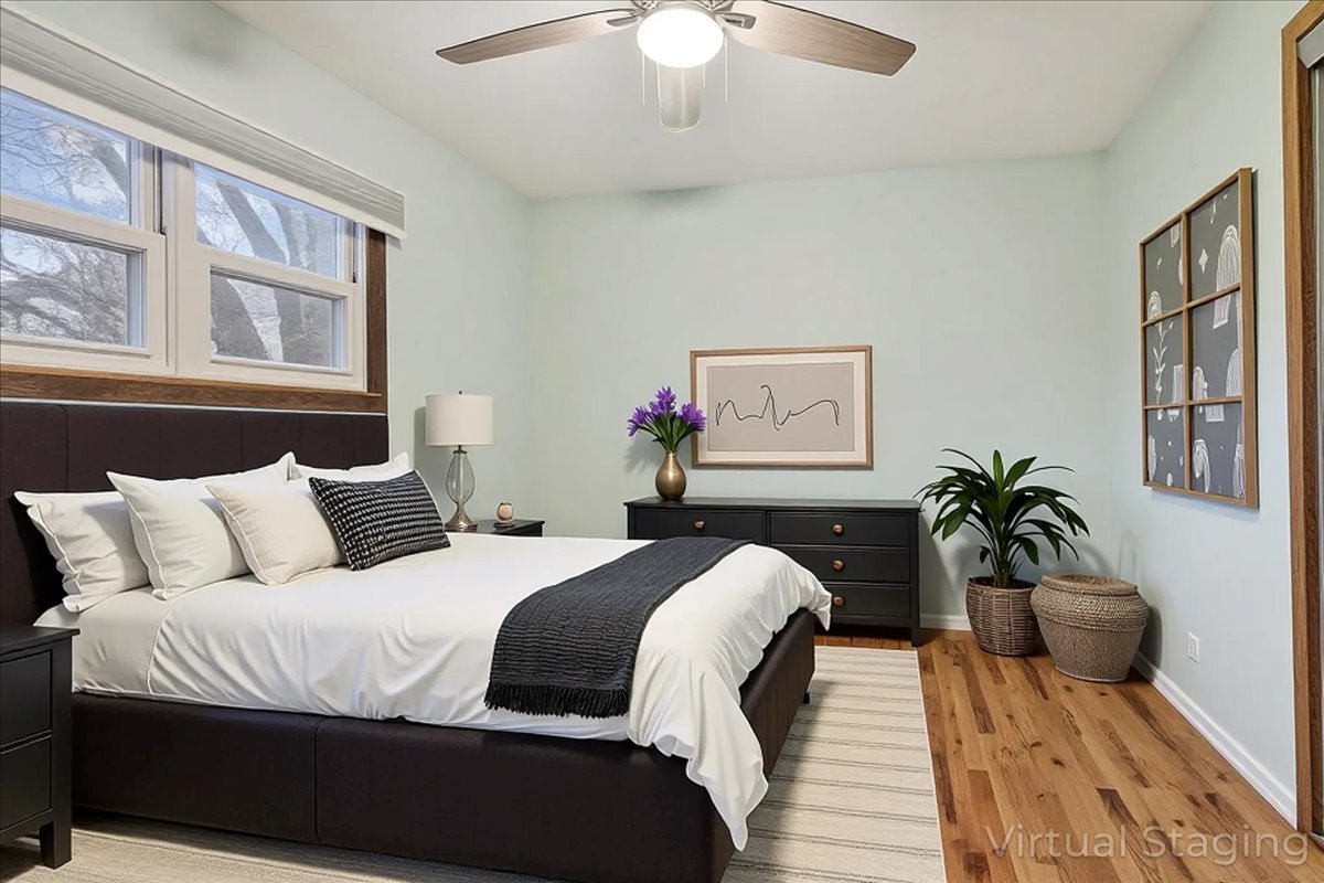 26-w028 Prairie Avenue Wheaton, IL 60187 - Photo 15 of 28 a bedroom with a bed and wooden floor