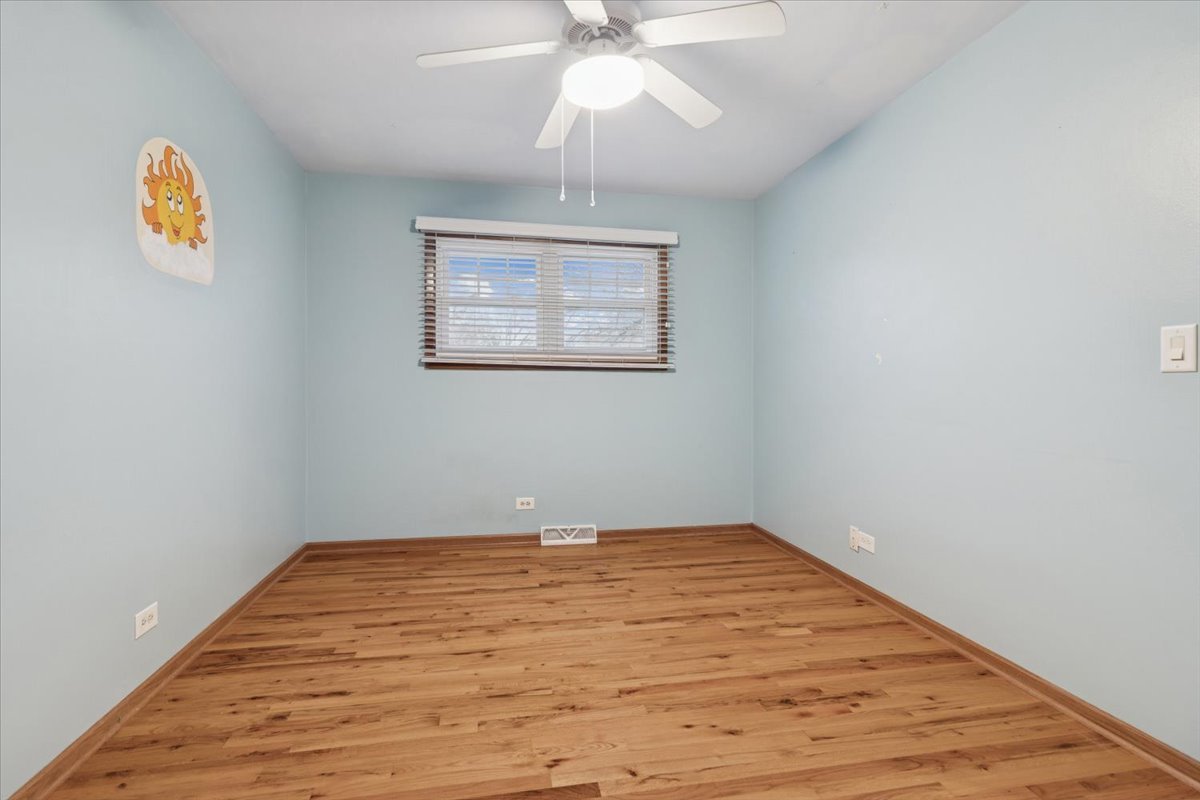 26-w028 Prairie Avenue Wheaton, IL 60187 - Photo 16 of 28 a view of an empty room with a window