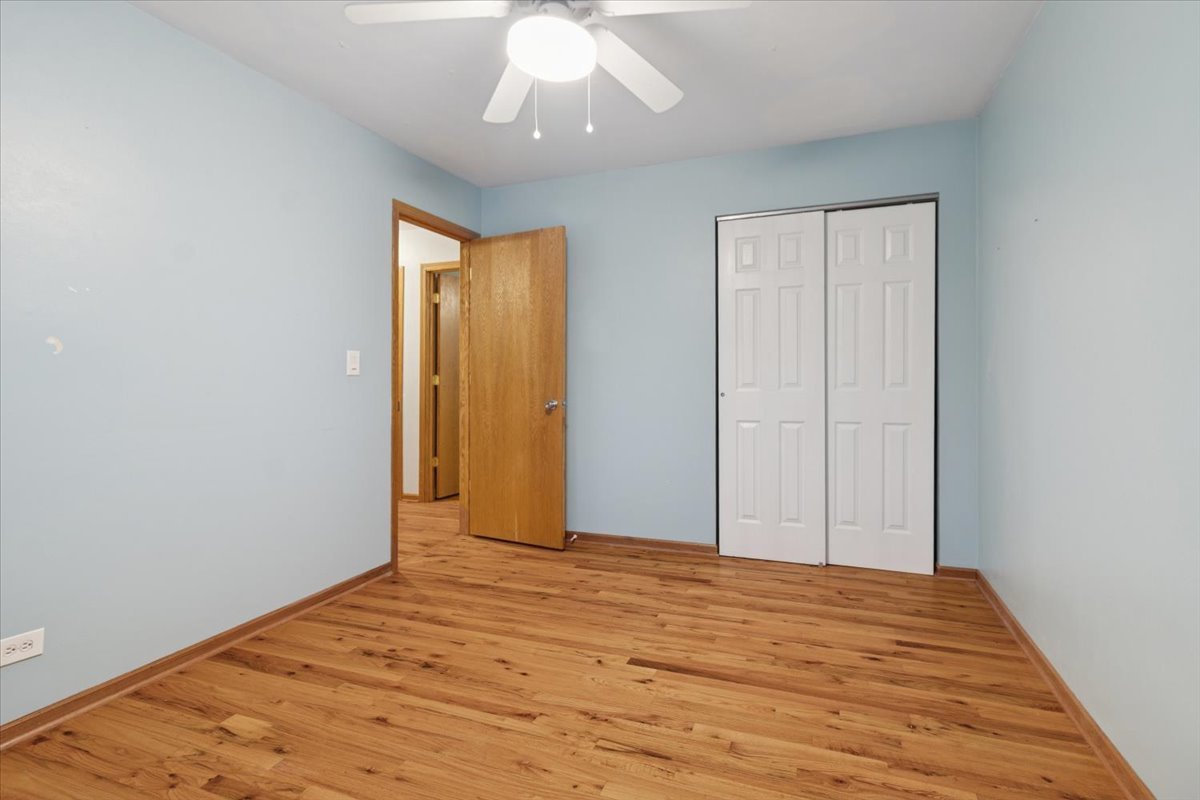 26-w028 Prairie Avenue Wheaton, IL 60187 - Photo 17 of 28 a view of empty room with wooden floor