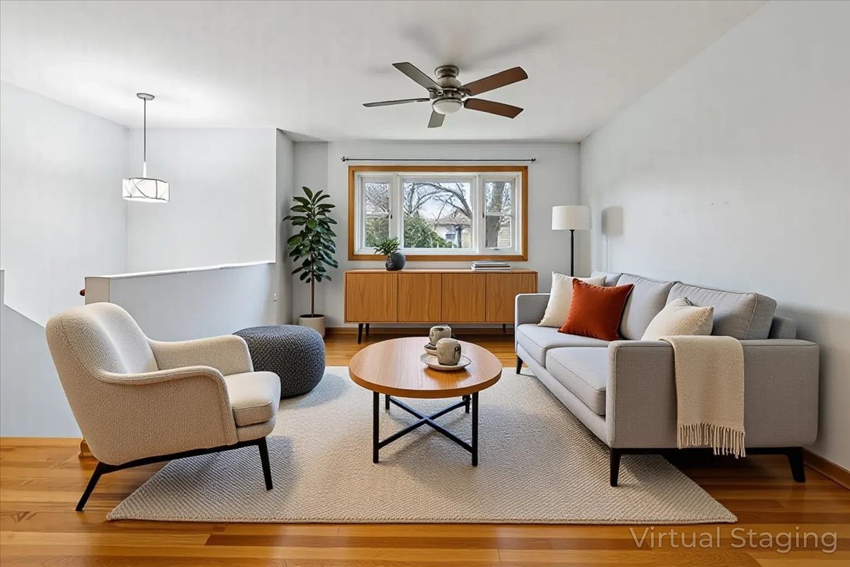 26-w028 Prairie Avenue Wheaton, IL 60187 - Photo 2 of 28 a living room with furniture a window and a potted plant