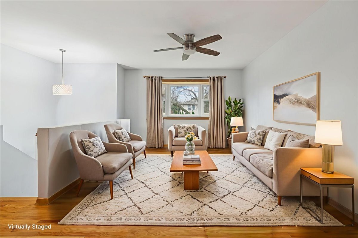 26-w028 Prairie Avenue Wheaton, IL 60187 - Photo 4 of 28 a living room with furniture a rug and a large window