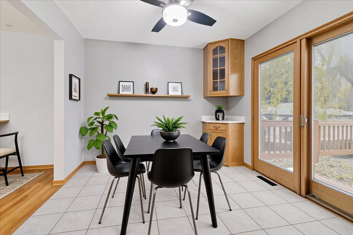 26-w028 Prairie Avenue Wheaton, IL 60187 - Photo 8 of 28 a view of a dining room with furniture and a potted plant
