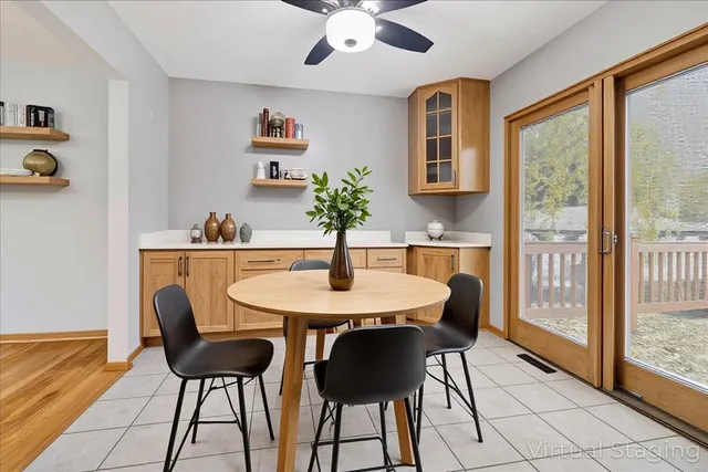a dining room with furniture and window