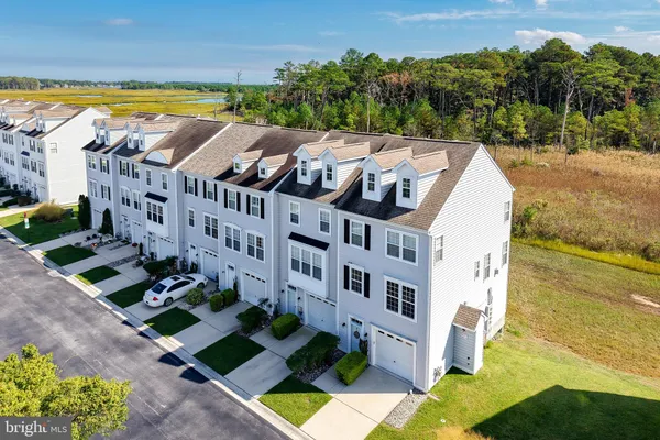 a view of building with swimming pool and ocean view
