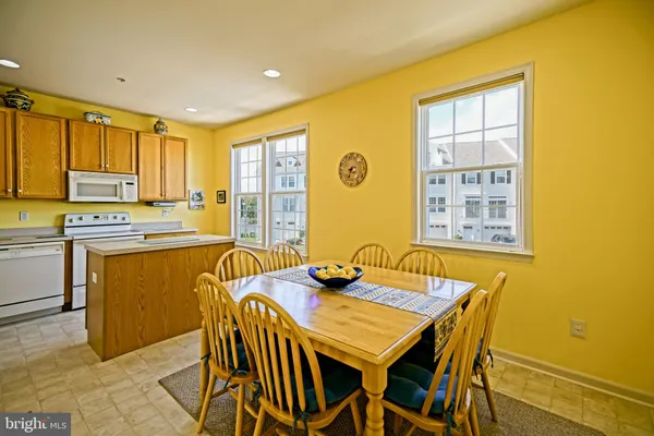 a view of a dining room with furniture and window