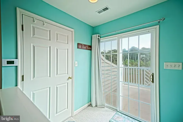 a view of balcony with wooden floor and outdoor seating
