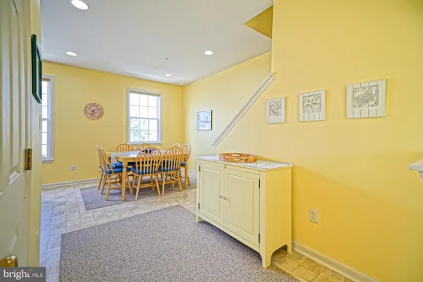 a view of a dining area with furniture and a window