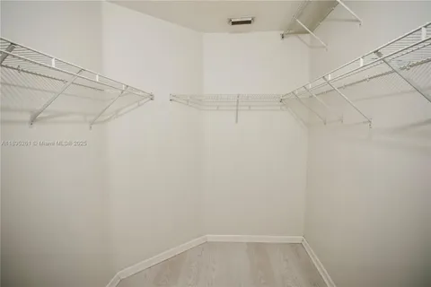 a view of a room with racks on the wall