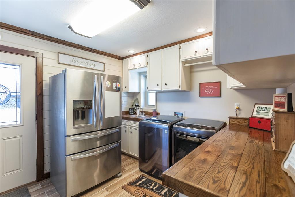 304 South Ave H Avenue Haskell, TX 79521 - Photo 13 of 38 a kitchen with stainless steel appliances granite countertop a refrigerator stove and sink