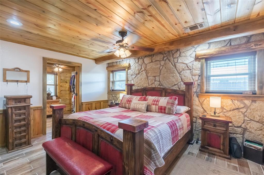 304 South Ave H Avenue Haskell, TX 79521 - Photo 16 of 38 a bedroom with a bed and wooden cabinets