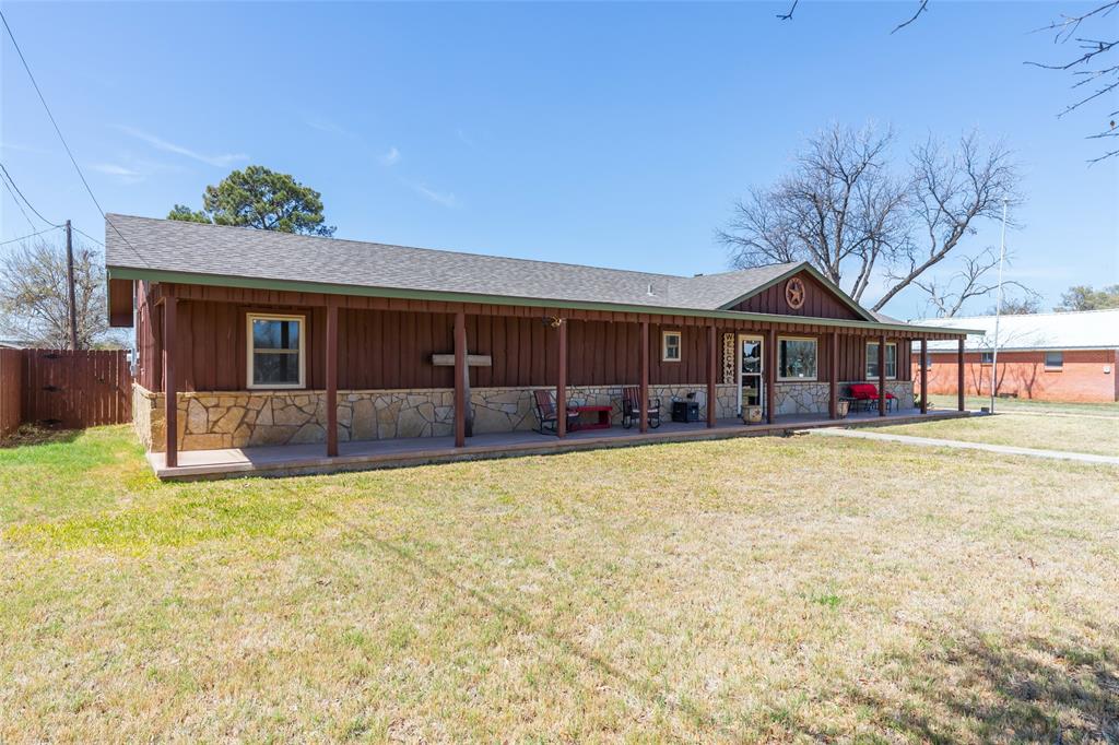 304 South Ave H Avenue Haskell, TX 79521 - Photo 3 of 38 a front view of a house with yard patio and swimming pool