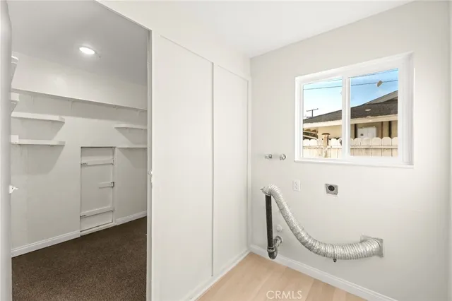 a view of workspace with wooden floor windows