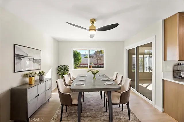 a dining room with furniture and window