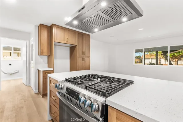 a kitchen with a stove and a refrigerator