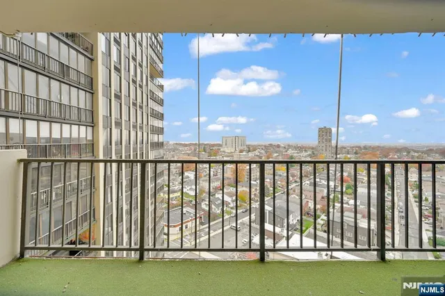 a kitchen with a stove and white cabinets