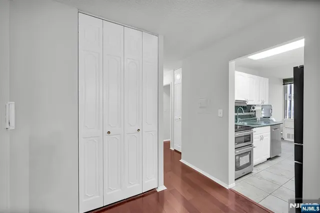 a view of a kitchen with wooden floor