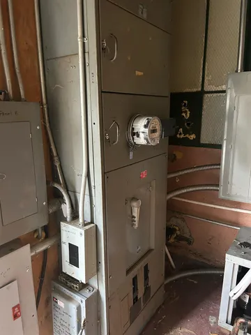 a backyard of a house with a yard and outdoor seating