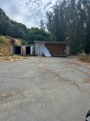 a backyard of a house with a yard and garage