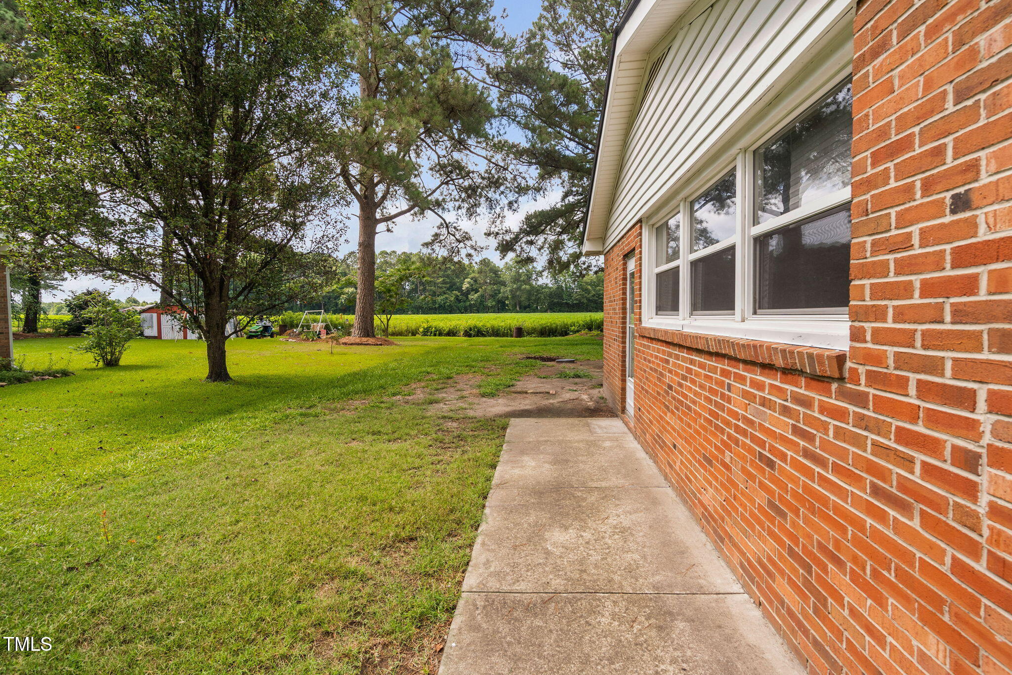 131 Biz Road Selma, NC 27576 - Photo 11 of 17 a view of a brick house with a yard