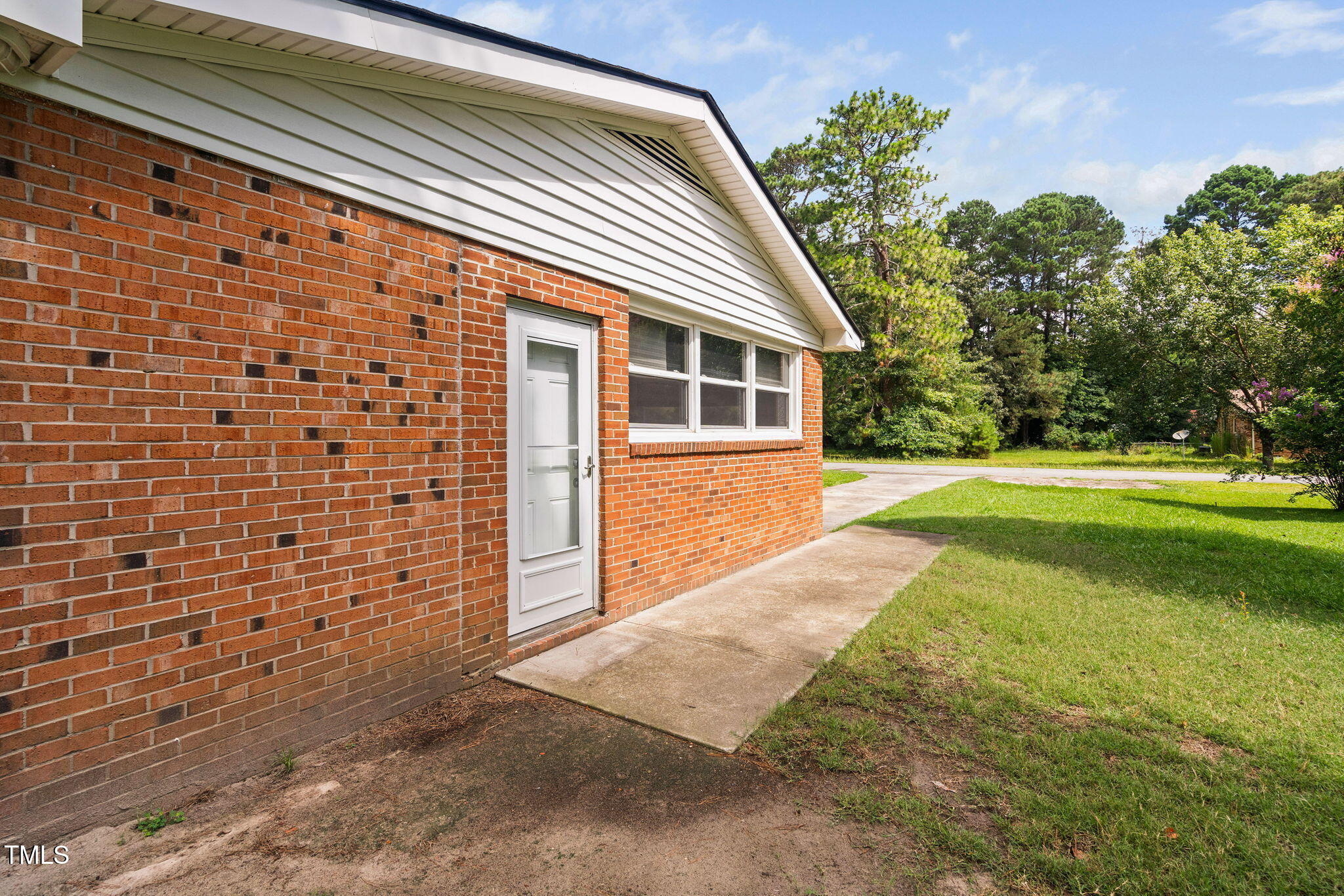 131 Biz Road Selma, NC 27576 - Photo 14 of 17 a view of a house with backyard and trees