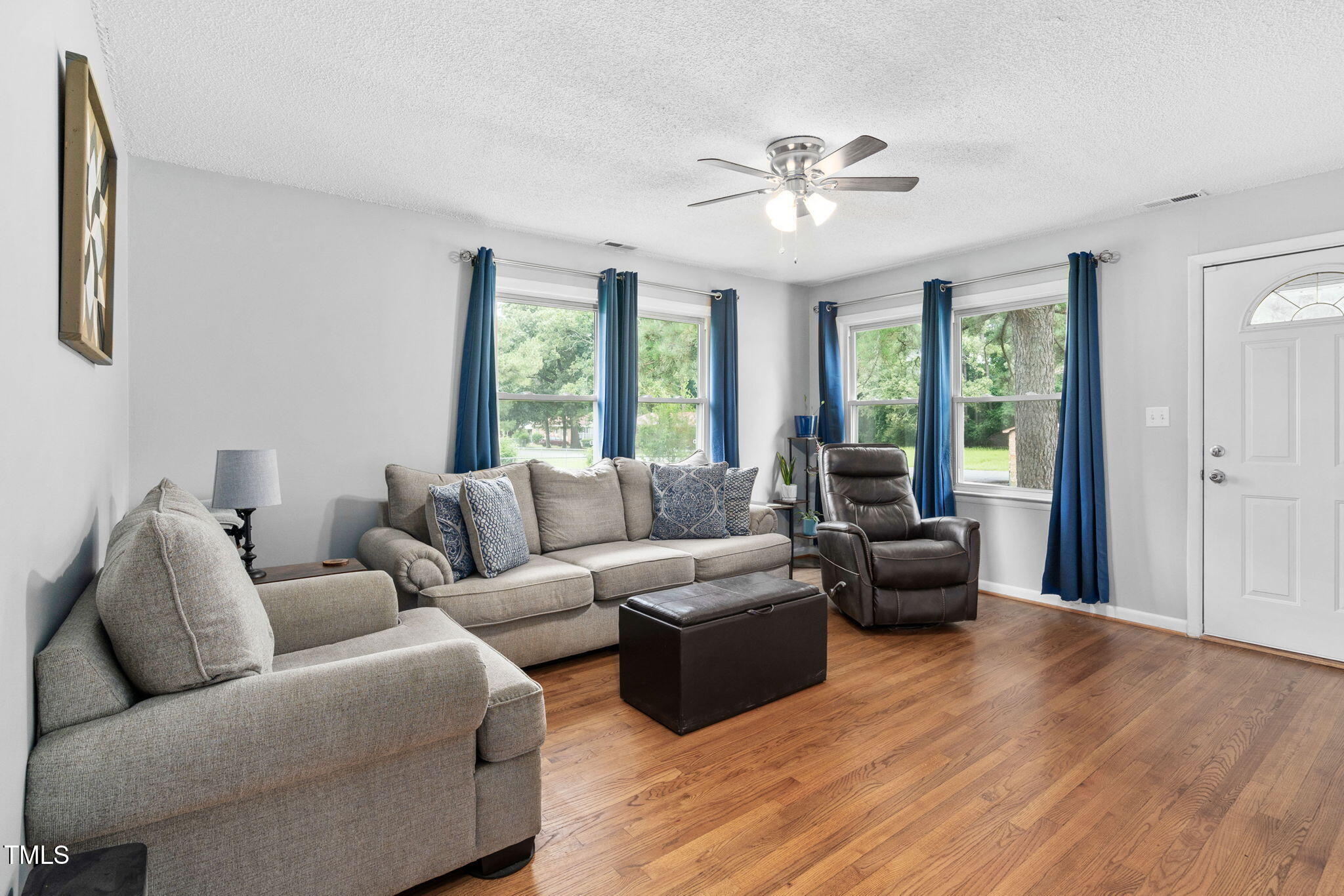131 Biz Road Selma, NC 27576 - Photo 3 of 17 a living room with furniture and a large window