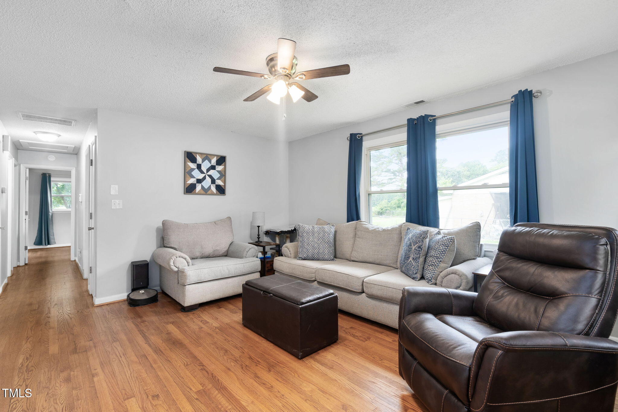 131 Biz Road Selma, NC 27576 - Photo 4 of 17 a living room with furniture and a large window