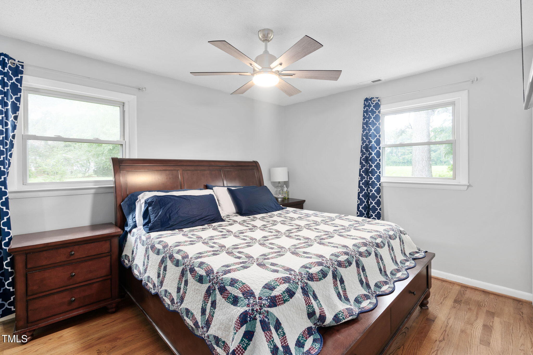 131 Biz Road Selma, NC 27576 - Photo 7 of 17 a bedroom with a bed and window