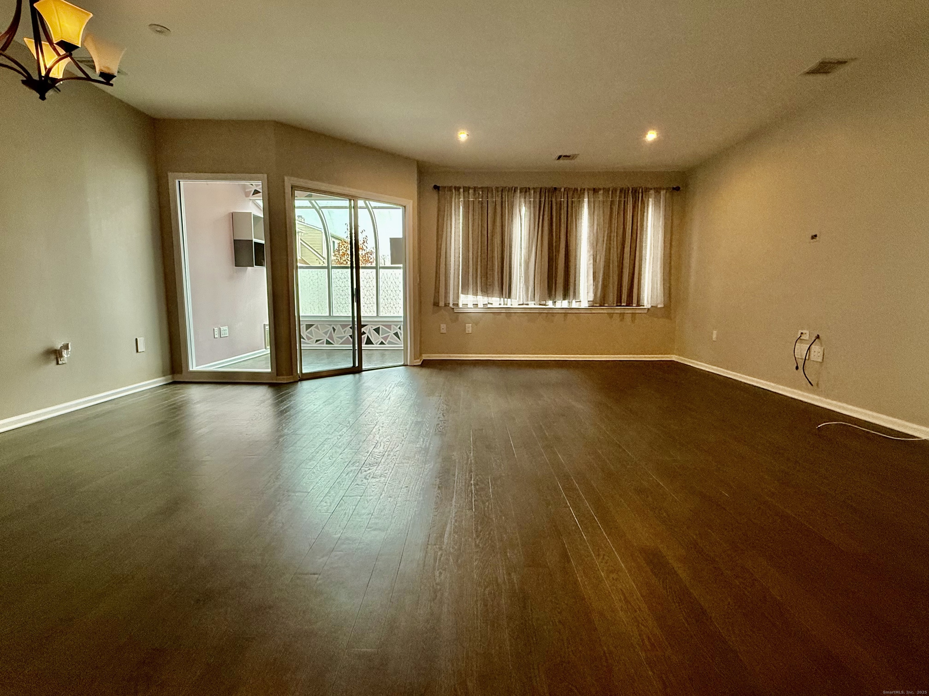 1900 Summer Street, Unit 15 Stamford, CT 06905 - Photo 11 of 34 The Spacious Living Room has access to the Sunroom/ Office