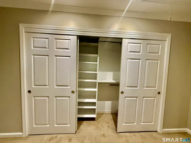 a bathroom with a shower and a sink